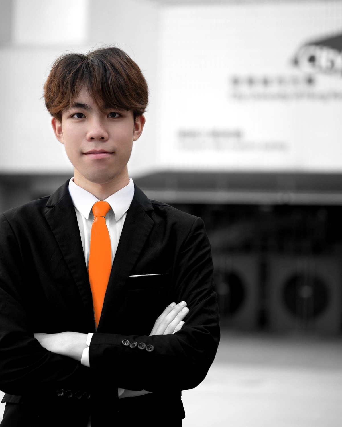 Wyatt Lo in front of a City University of Hong Kong building.