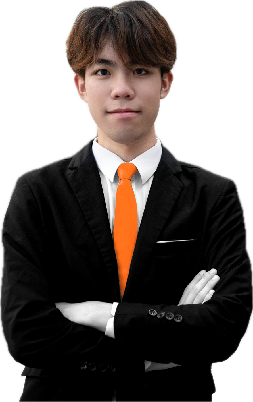 Wyatt Lo in a black suit with arms crossed, wearing an orange tie.